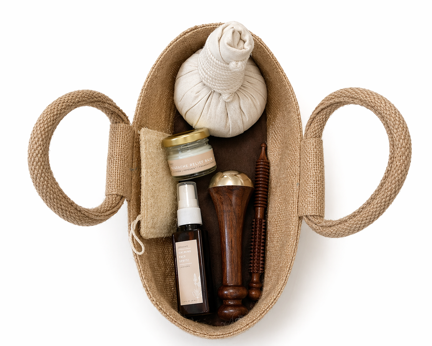 Basket with massage tools including a herbal compress, acupressure stick, and headache relief balm, loofah, kansa wand, lavender face spray and satin eye pillow