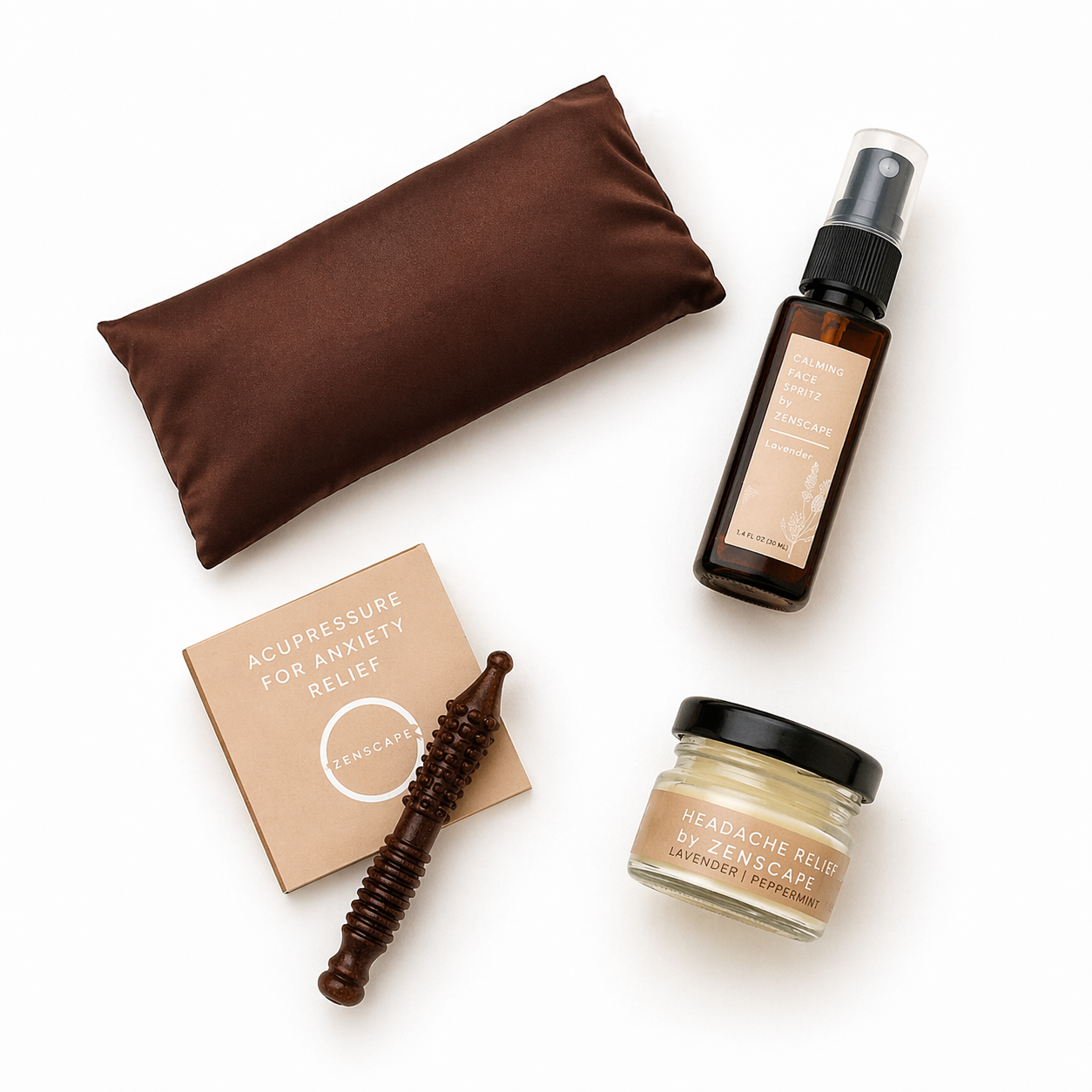 Collection of wellness products including a satin eye pillow, acupressure stick, and headache relief balm and lavender face spray