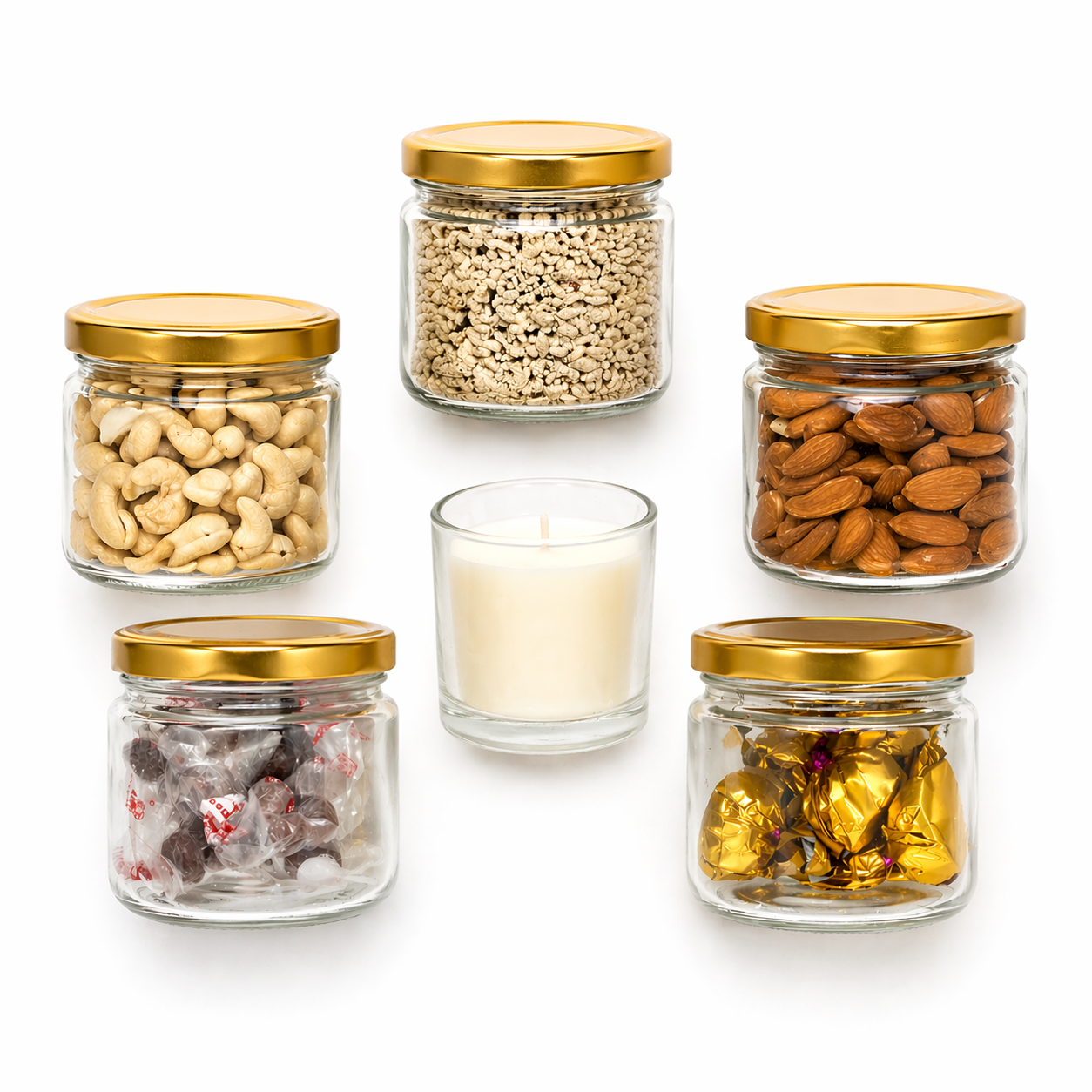 Five glass jars with gold lids containing various snacks and scented candle 